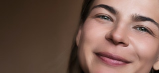 Portrait of young woman with soft skin after skin retouching.