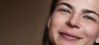 Portrait of young woman with soft skin after skin retouching.